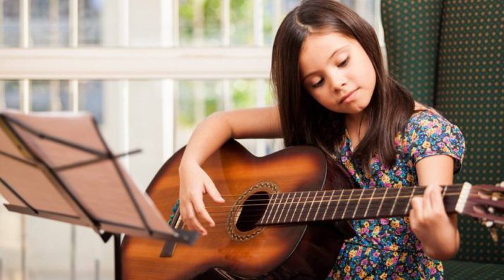 kid girl play guitar